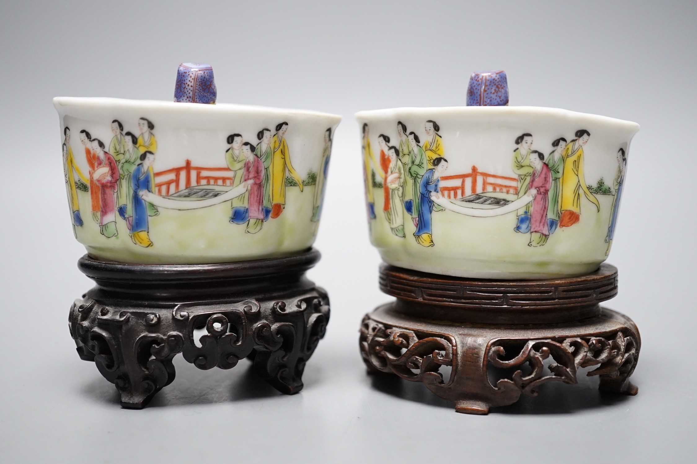 A pair of 19th century Chinese famille rose puzzle cups on stands, 8cm tall overall